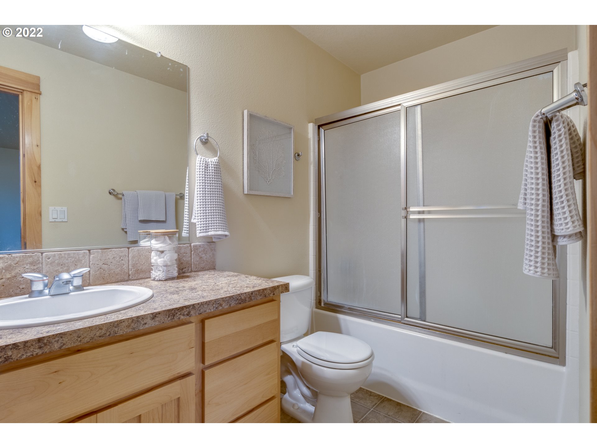 640 Southwest Trout Court Camas, WA 98607 - Photo 14 of 32 a bathroom with a granite countertop sink toilet and shower