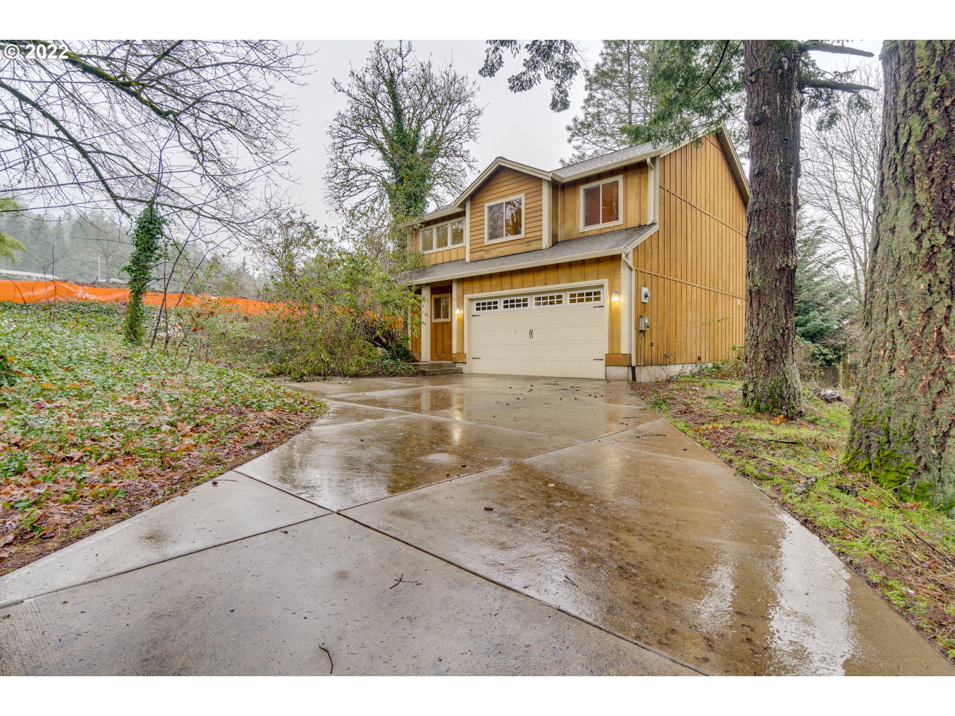 640 Southwest Trout Court Camas, WA 98607 - Photo 30 of 32 a view of a grey house with a yard