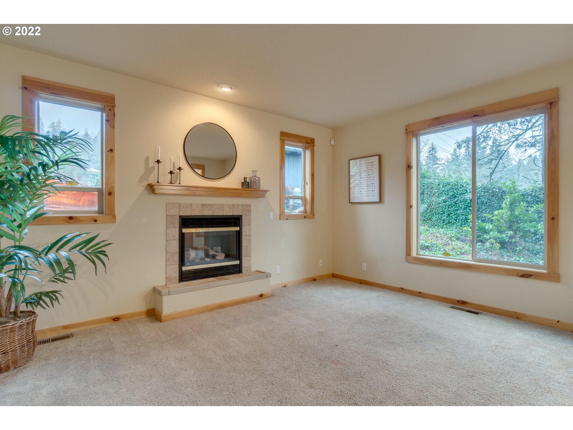 640 Southwest Trout Court Camas, WA 98607 - Photo 4 of 32 a view of an empty room with a fireplace and a window