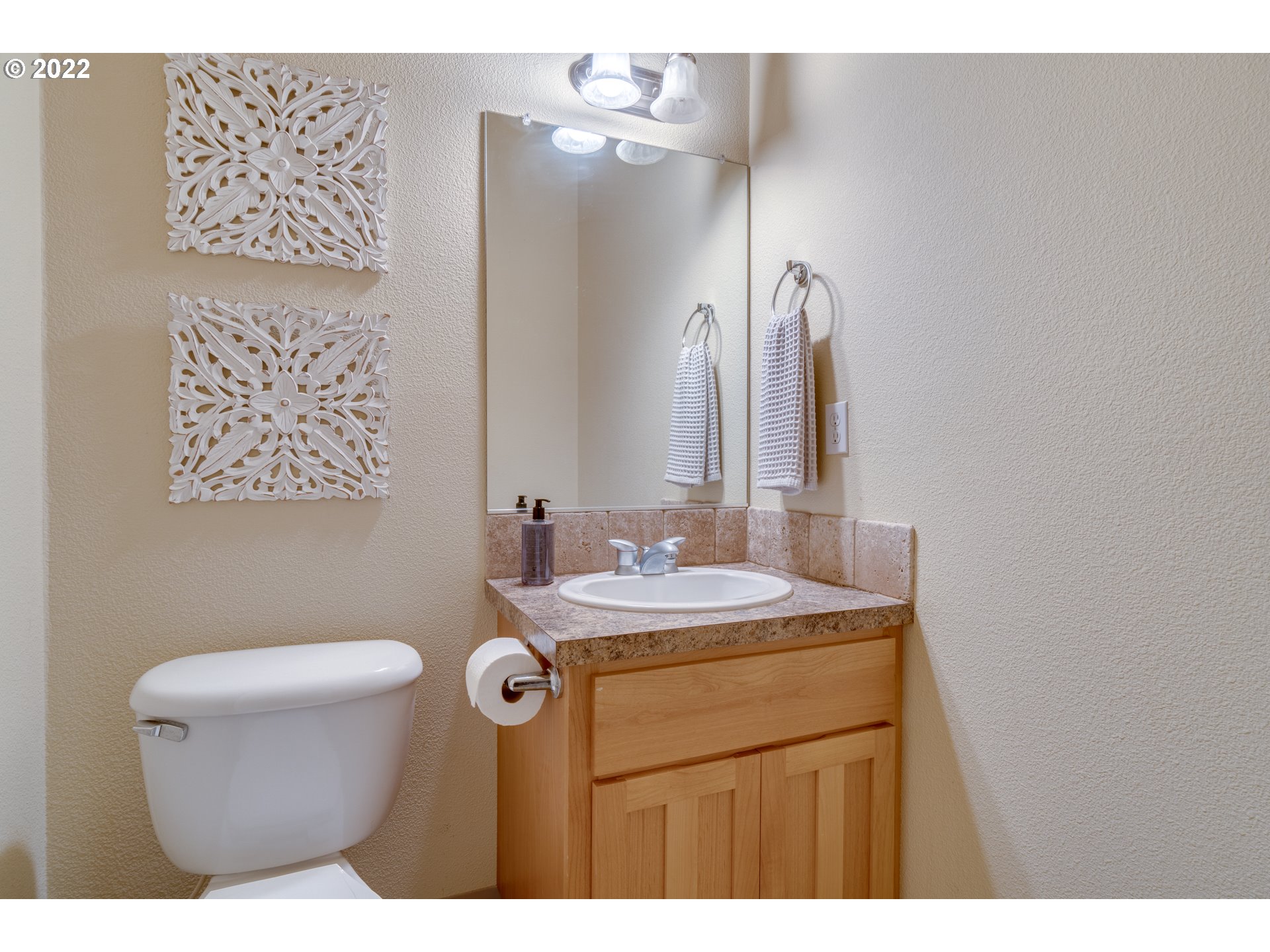 640 Southwest Trout Court Camas, WA 98607 - Photo 10 of 32 a bathroom with a sink a toilet and mirror