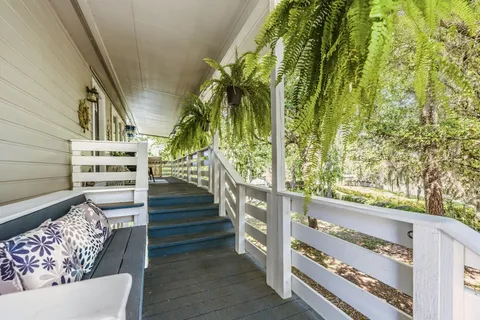 a view of stairs and wooden floor