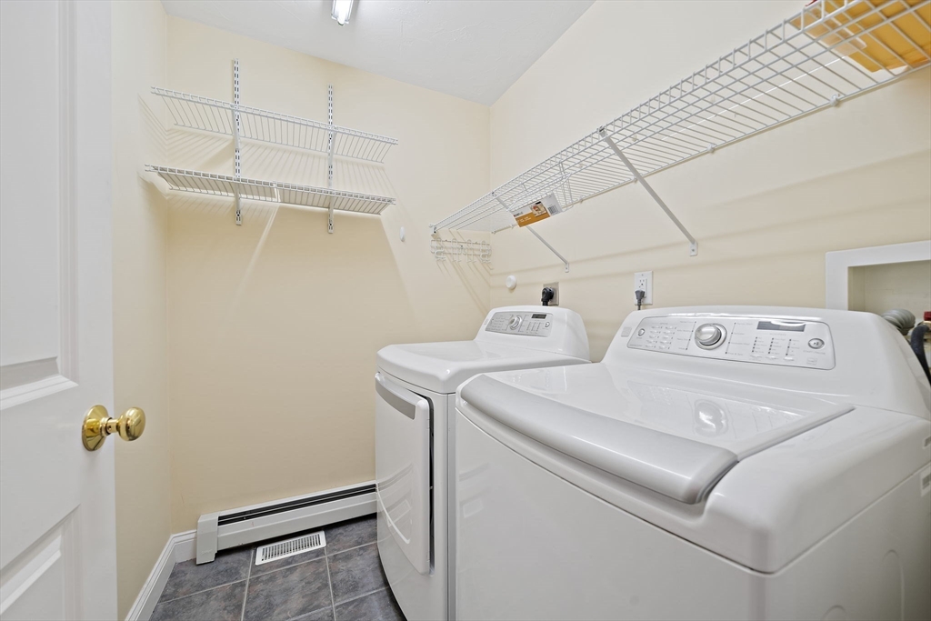 14 Sugar Maple Circle, Unit 14 Hanover, MA 02339 - Photo 15 of 38 a utility room with dryer and washer