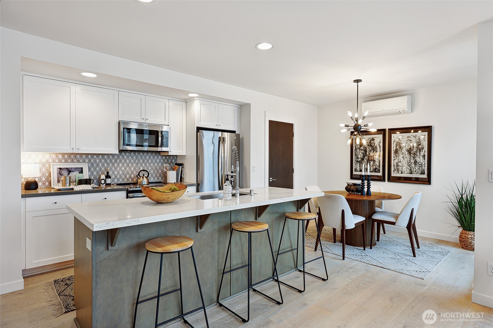 3717 South Dawson Street Seattle, WA 98118 - Photo 18 of 40 a kitchen with a dining table chairs and refrigerator