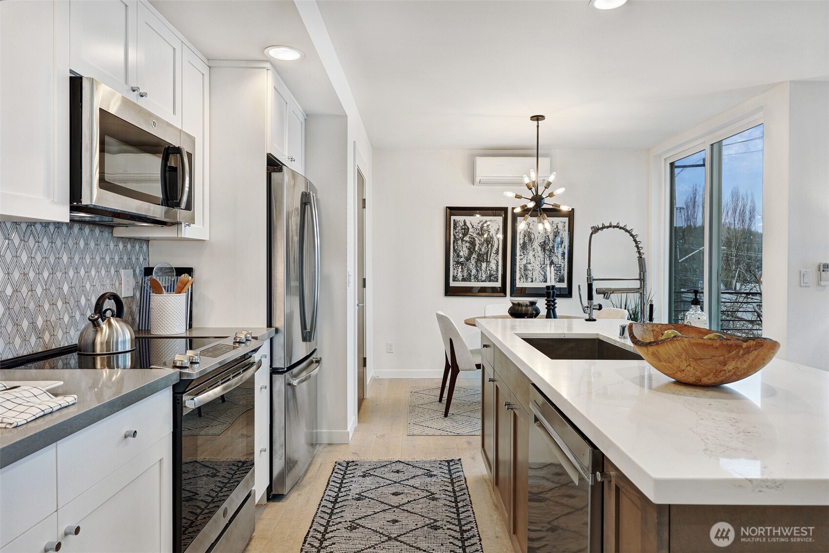 3717 South Dawson Street Seattle, WA 98118 - Photo 22 of 40 a kitchen with stainless steel appliances a sink stove and refrigerator