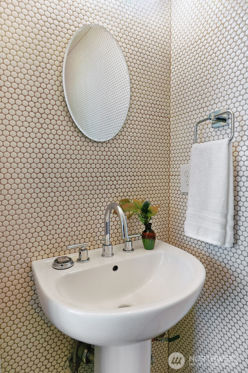 3717 South Dawson Street Seattle, WA 98118 - Photo 26 of 40 a bathroom with a sink and mirror