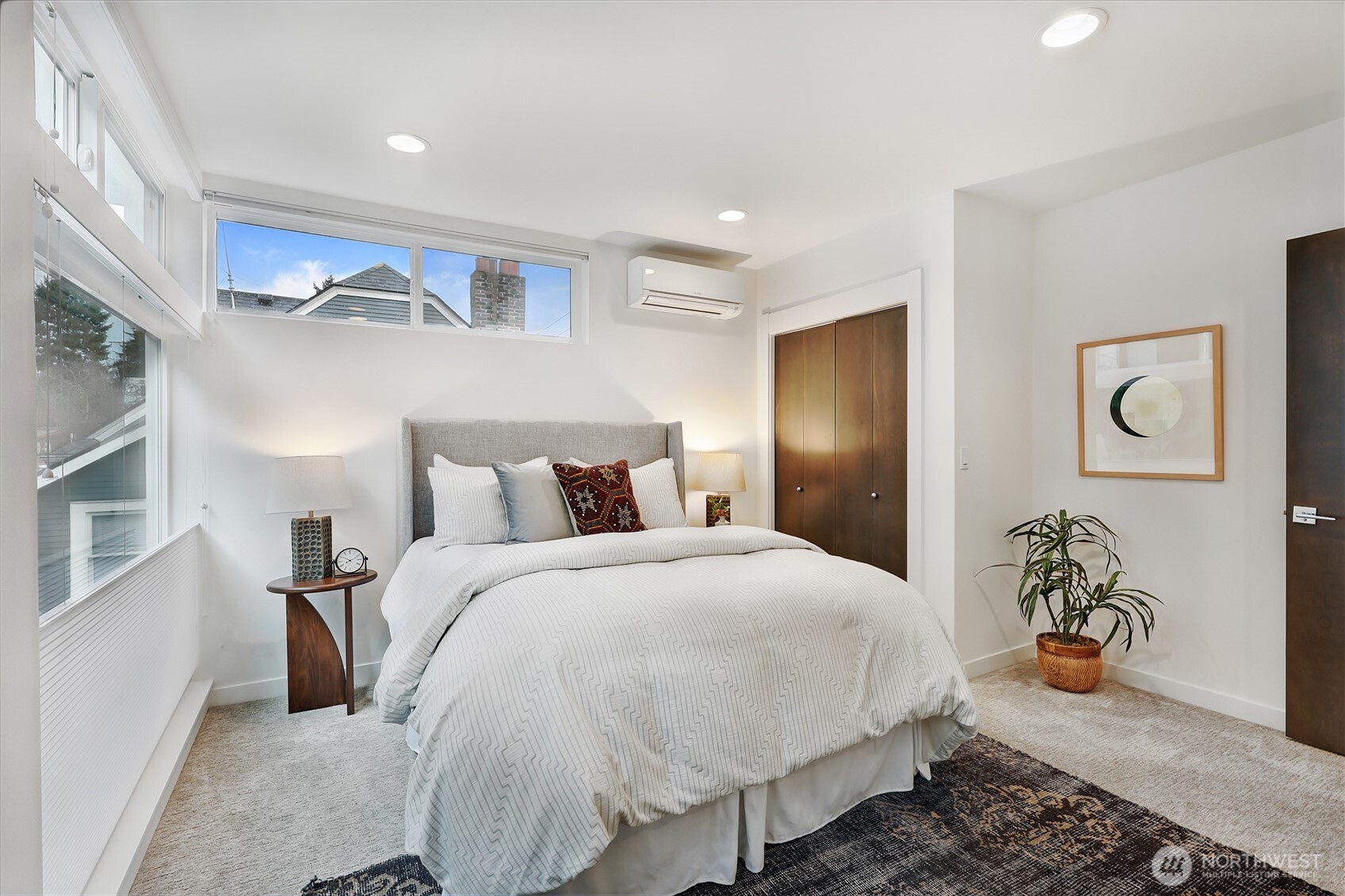 3717 South Dawson Street Seattle, WA 98118 - Photo 5 of 40 a spacious bedroom with a bed and potted plant