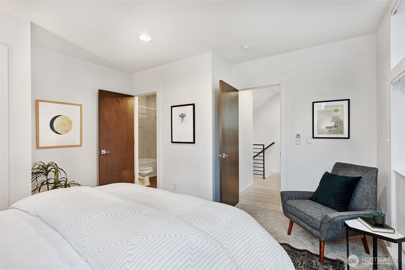 3717 South Dawson Street Seattle, WA 98118 - Photo 6 of 40 a bedroom with a bed and wooden floor