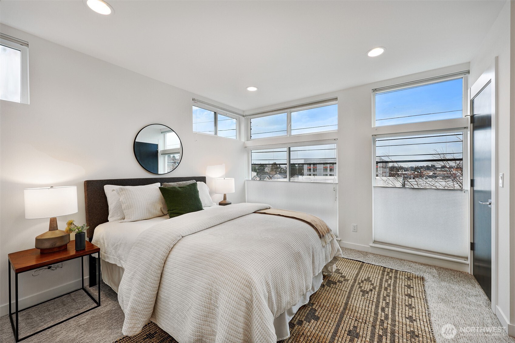 3717 South Dawson Street Seattle, WA 98118 - Photo 9 of 40 a bedroom with a large bed and a window