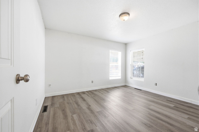 29 Grover Street Layton, UT 84041 - Photo 17 of 29 Room featuring light wood-finish flooring and bright white walls