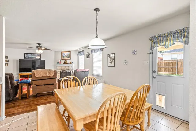 a dining room with furniture and window