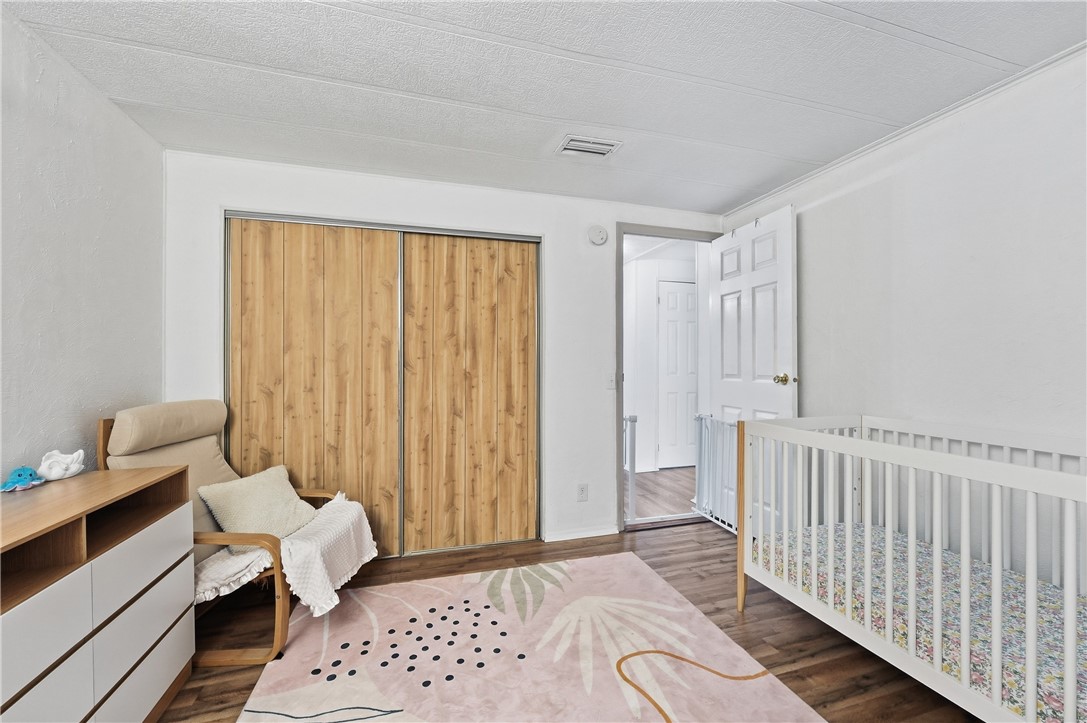 566 Dolphin Circle Sebastian, FL 32976 - Photo 17 of 36 a bedroom with furniture and a window