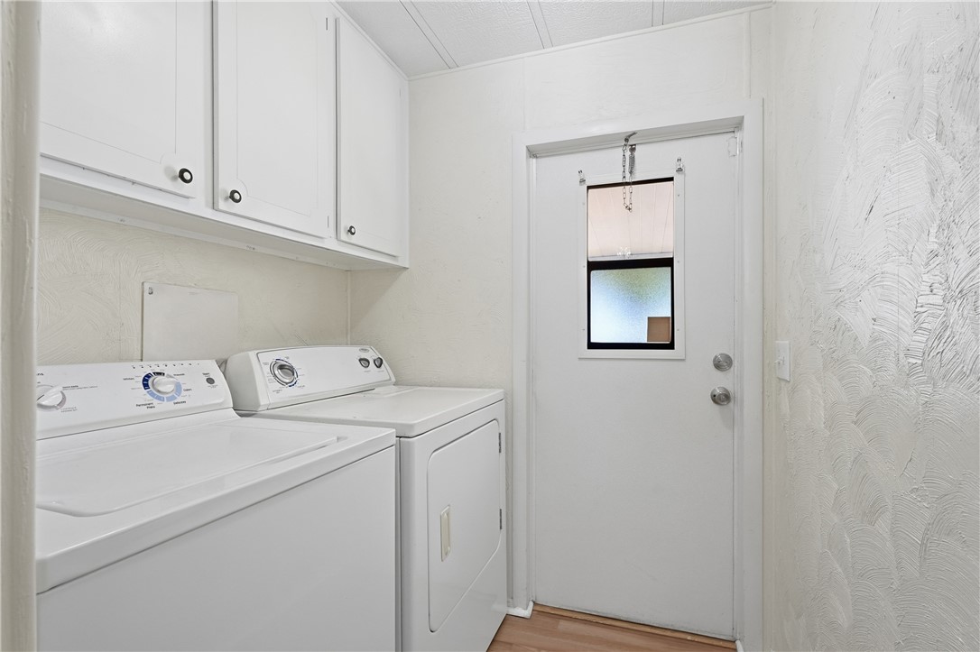 566 Dolphin Circle Sebastian, FL 32976 - Photo 21 of 36 a utility room with dryer and washer