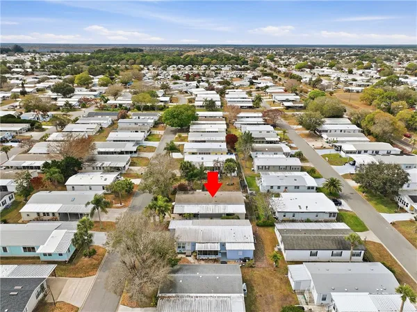 an aerial view of residential houses with city view