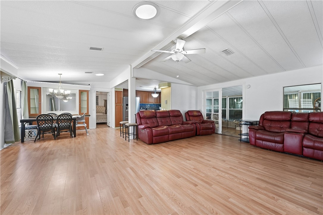 566 Dolphin Circle Sebastian, FL 32976 - Photo 8 of 36 a living room with furniture and wooden floor