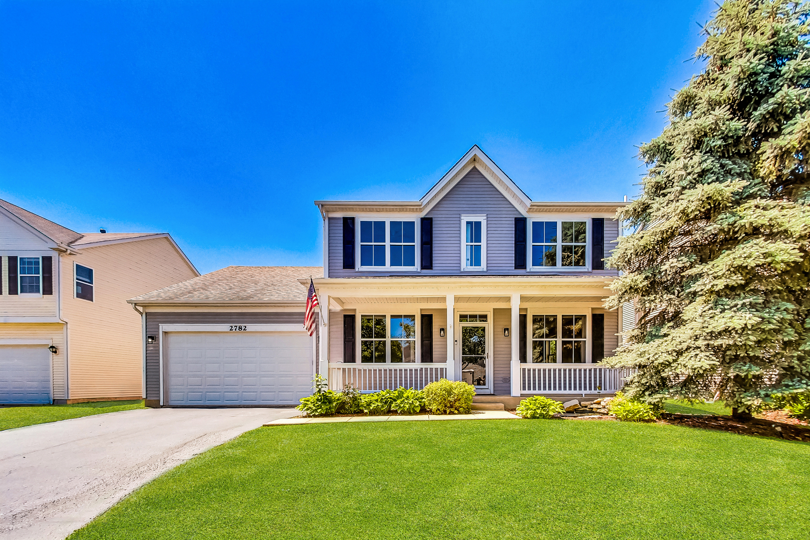 2782 Moraine Valley Road Wauconda, IL 60084 - Photo 1 of 24 a front view of a house with a garden and yard