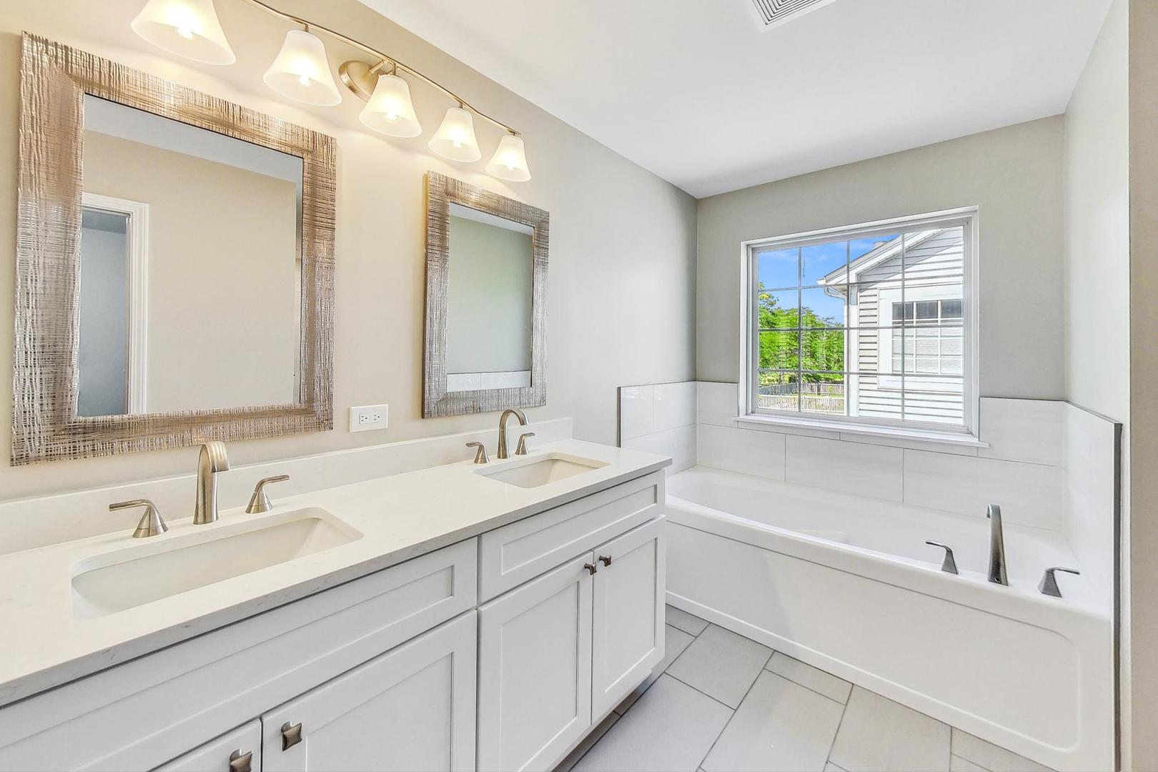 2782 Moraine Valley Road Wauconda, IL 60084 - Photo 11 of 24 a bathroom with a sink and a bathtub