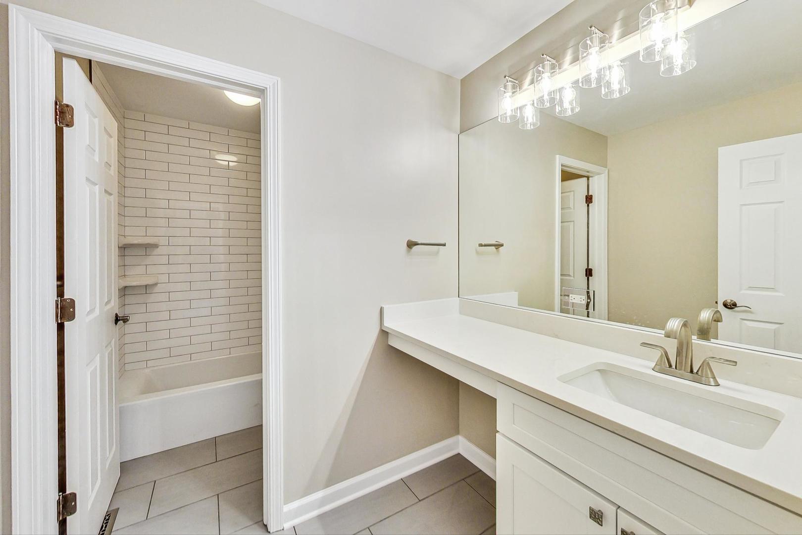 2782 Moraine Valley Road Wauconda, IL 60084 - Photo 16 of 24 a bathroom with a sink and a mirror
