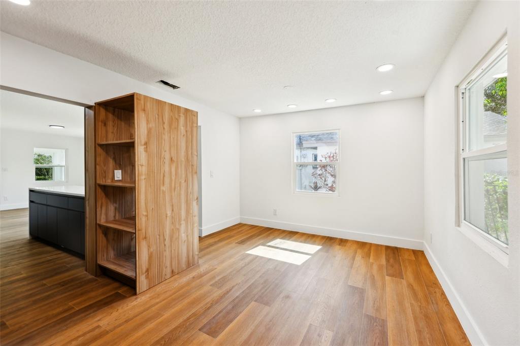 730 West Swoope Avenue Winter Park, FL 32789 - Photo 12 of 72 a view of empty room with wooden floor and window