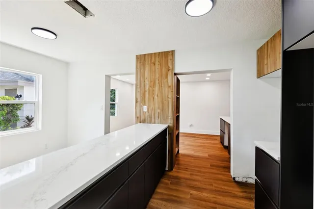 a view of a house with wooden floor and outdoor space