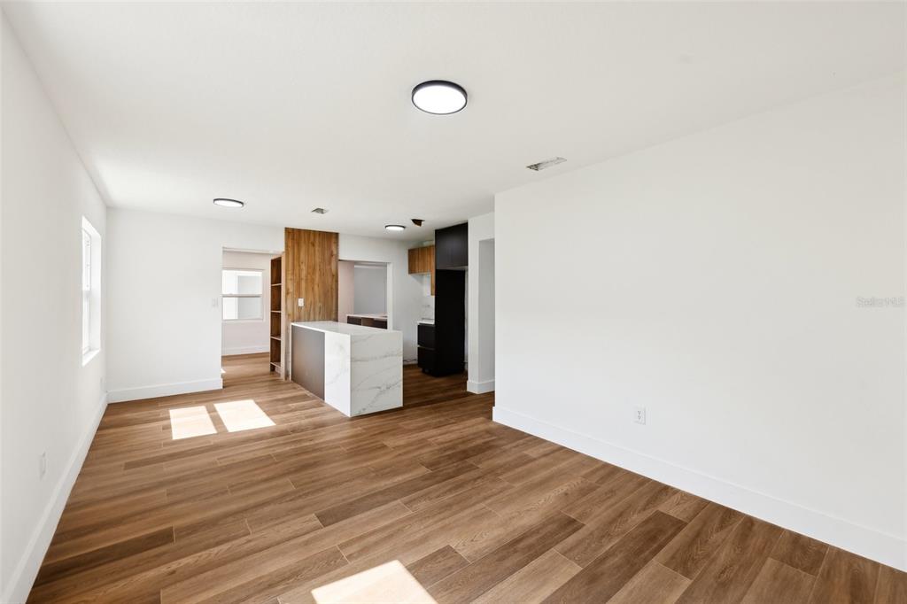 730 West Swoope Avenue Winter Park, FL 32789 - Photo 19 of 72 a view of a kitchen with wooden floor and a sink
