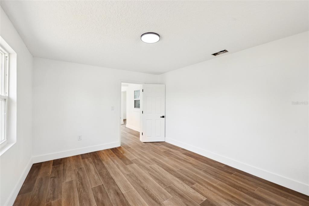 730 West Swoope Avenue Winter Park, FL 32789 - Photo 25 of 72 a view of a room with wooden floor and white walls