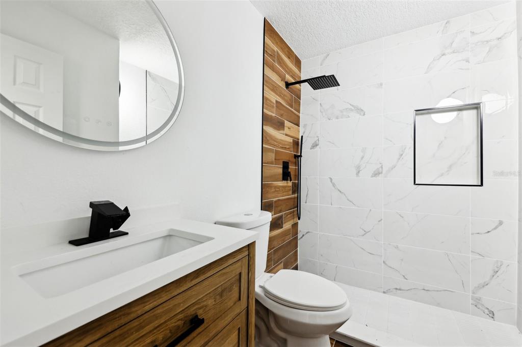 730 West Swoope Avenue Winter Park, FL 32789 - Photo 28 of 72 a bathroom with a sink a toilet and shower