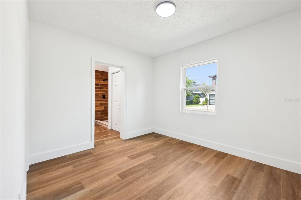 730 West Swoope Avenue Winter Park, FL 32789 - Photo 31 of 72 an empty room with wooden floor and windows