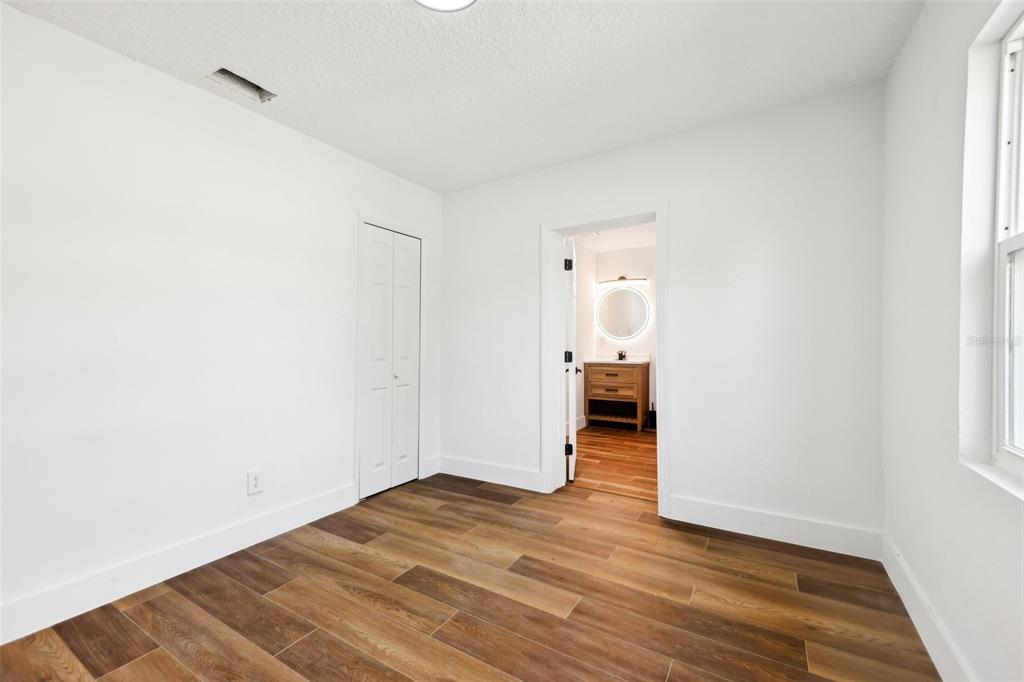 730 West Swoope Avenue Winter Park, FL 32789 - Photo 32 of 72 a big room with wooden floor and a bathroom