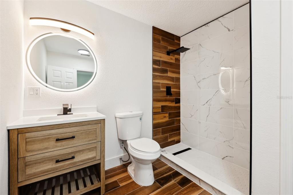 730 West Swoope Avenue Winter Park, FL 32789 - Photo 33 of 72 a bathroom with a sink a toilet and a mirror