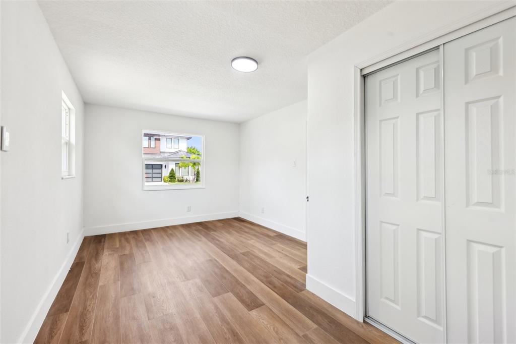 730 West Swoope Avenue Winter Park, FL 32789 - Photo 35 of 72 an empty room that has a window with wooden floor