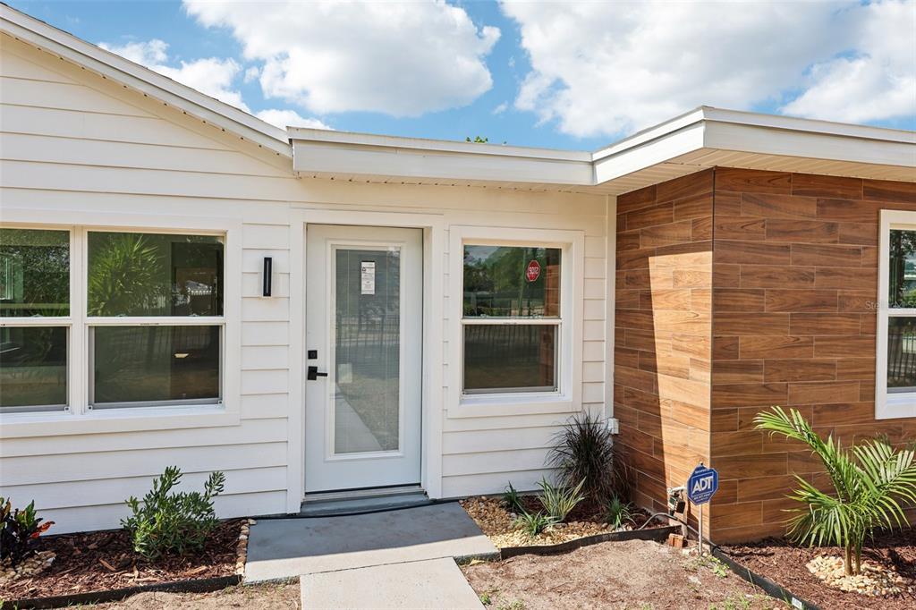 730 West Swoope Avenue Winter Park, FL 32789 - Photo 4 of 72 a front view of a house with a garden