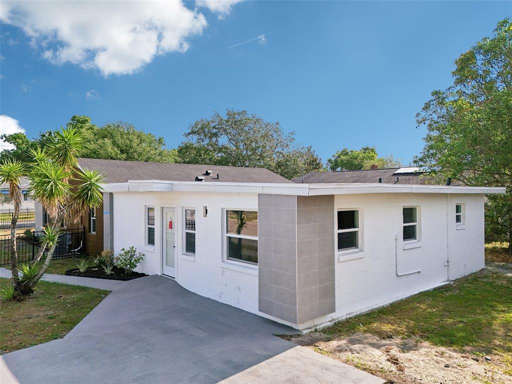 730 West Swoope Avenue Winter Park, FL 32789 - Photo 42 of 72 a view of a white house with a yard