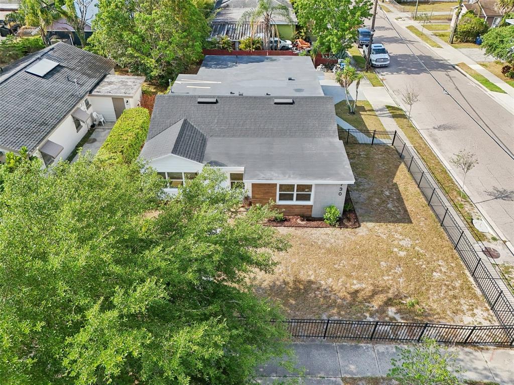 730 West Swoope Avenue Winter Park, FL 32789 - Photo 46 of 72 an aerial view of a house with a yard and large trees