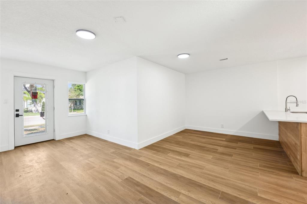 730 West Swoope Avenue Winter Park, FL 32789 - Photo 9 of 72 wooden floor in an empty room with a window