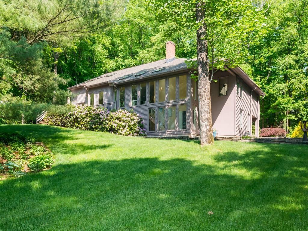 a backyard of a house with lots of green space
