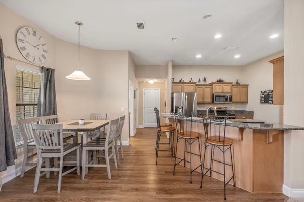 a living room with couches and flat screen tv
