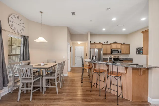 a living room with couches and flat screen tv