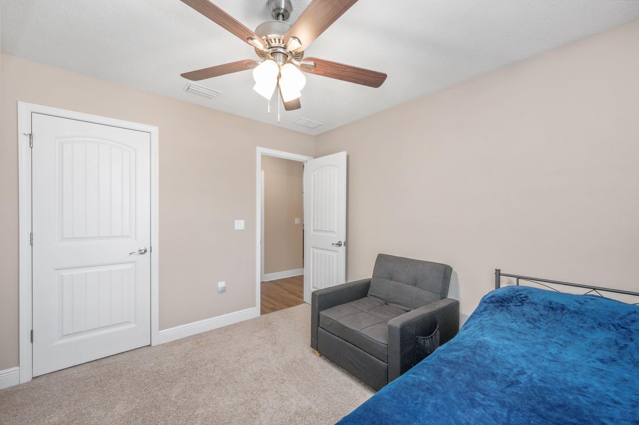 2342 Genevieve Way Crestview, FL 32536 - Photo 19 of 41 a living room with furniture and a chandelier