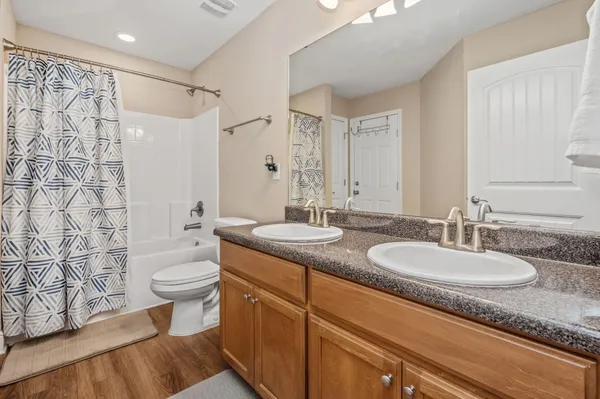 a bathroom with a toilet and shower