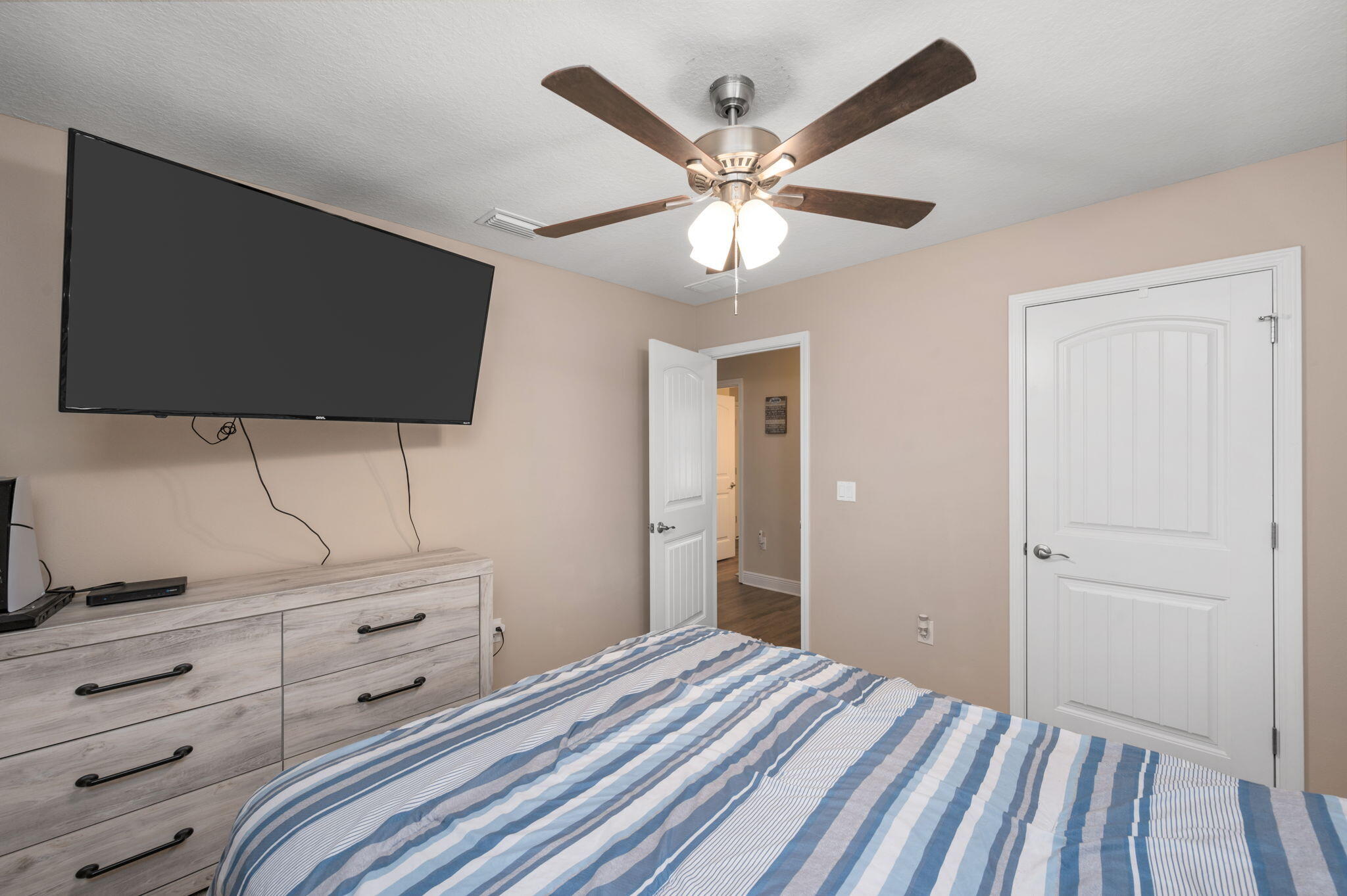 2342 Genevieve Way Crestview, FL 32536 - Photo 23 of 41 a bedroom with a bed and a flat screen tv
