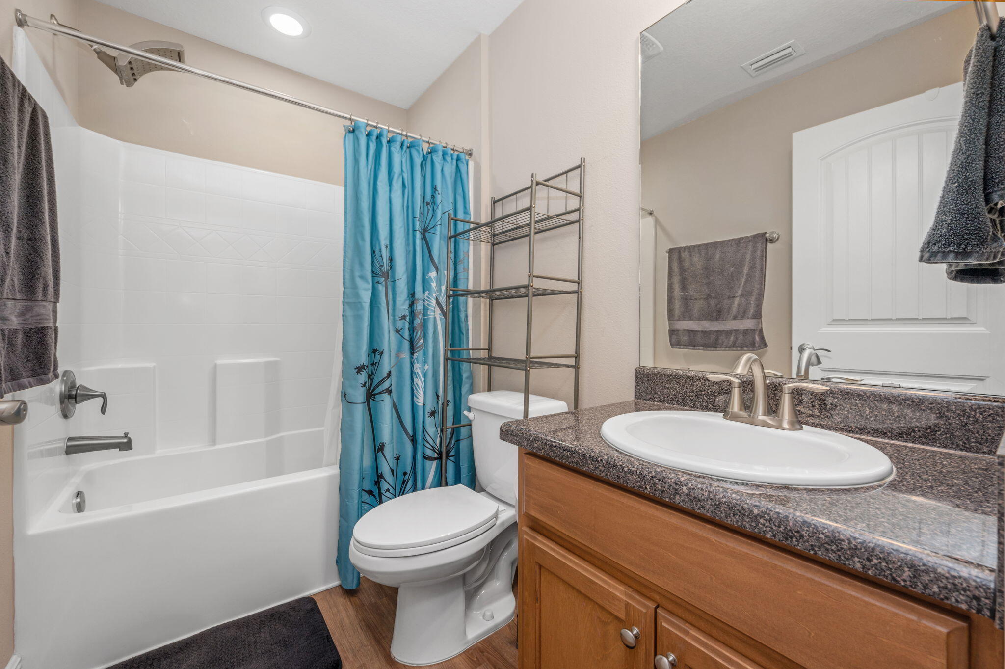 2342 Genevieve Way Crestview, FL 32536 - Photo 26 of 41 a bathroom with a granite countertop sink toilet mirror and shower