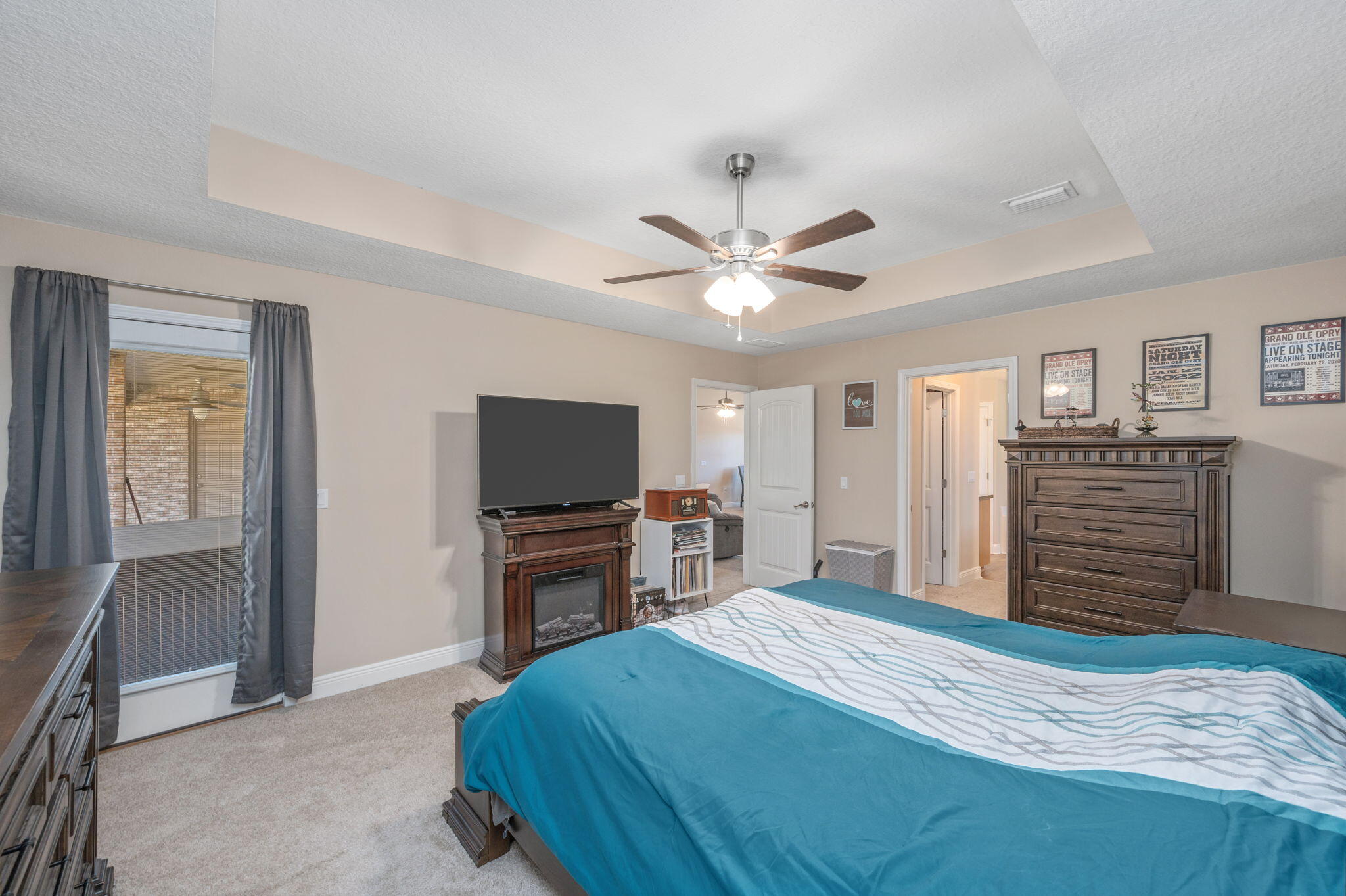 2342 Genevieve Way Crestview, FL 32536 - Photo 28 of 41 a bedroom with a bed and a flat screen tv