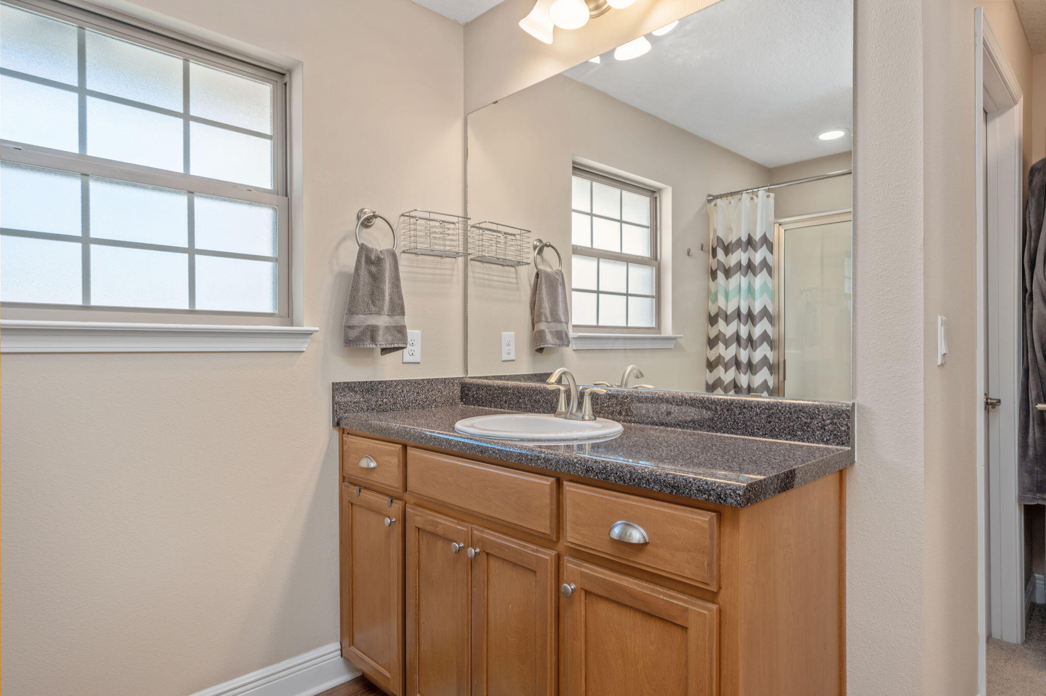 2342 Genevieve Way Crestview, FL 32536 - Photo 31 of 41 a bathroom with a granite countertop sink and a window