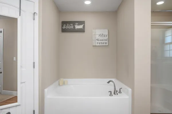 a view of an empty room with a birdcage and a window