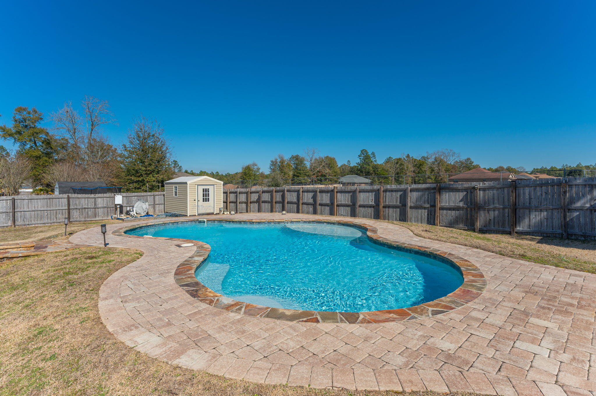 2342 Genevieve Way Crestview, FL 32536 - Photo 36 of 41 a view of a swimming pool with a lounge chair