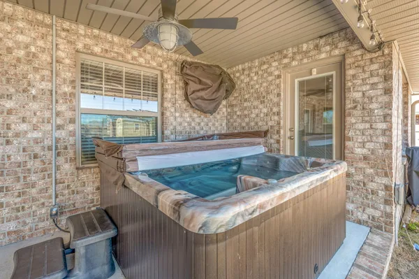 a view of swimming pool with outdoor seating and yard in the back