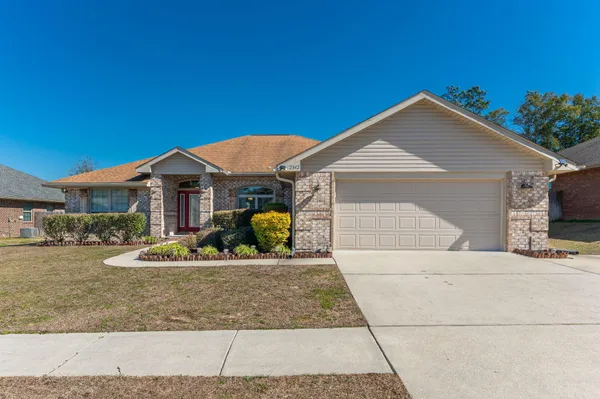 a front view of house with yard outdoor seating and barbeque oven