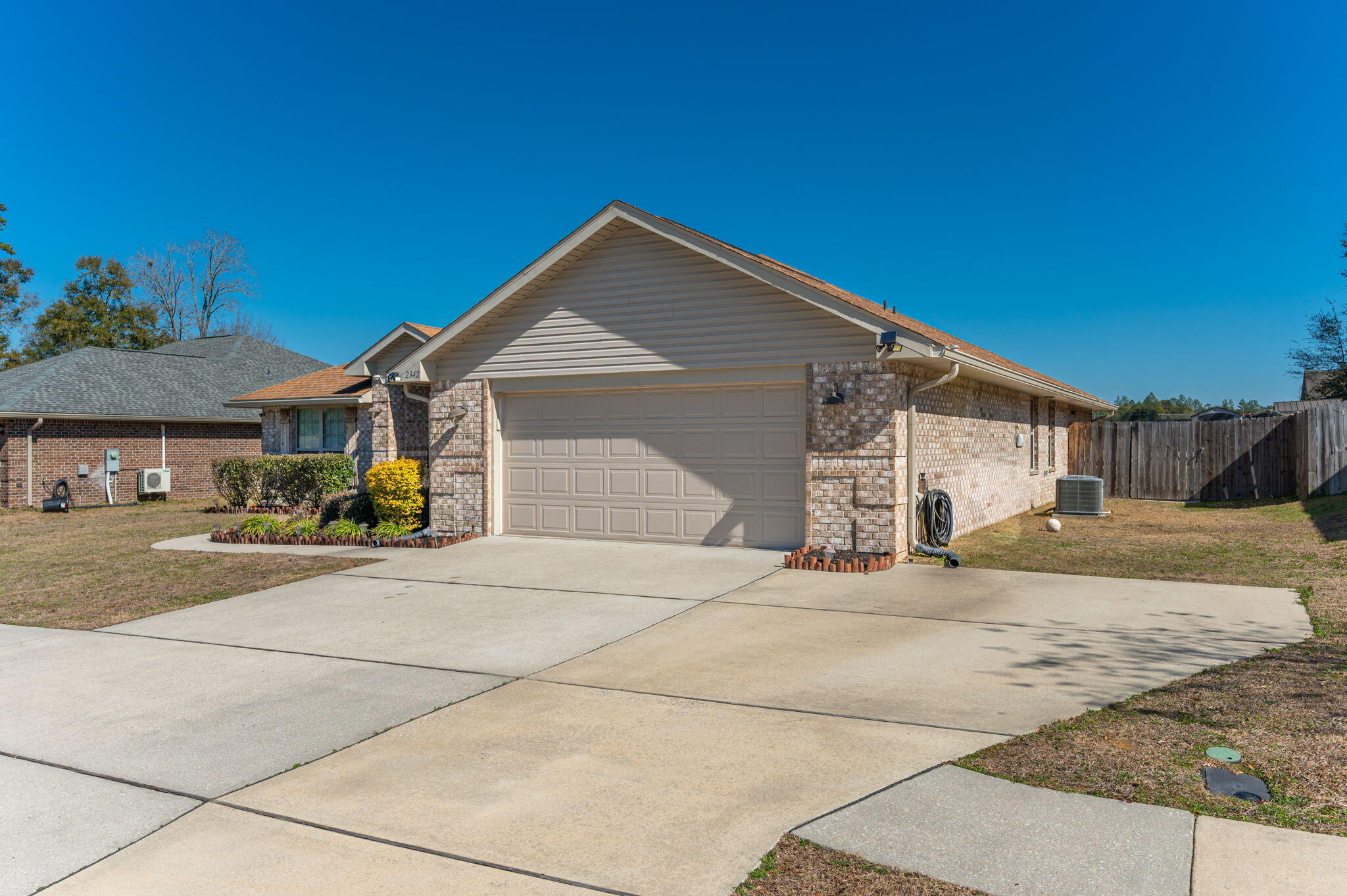 2342 Genevieve Way Crestview, FL 32536 - Photo 5 of 41 a front view of a house with a yard and garage