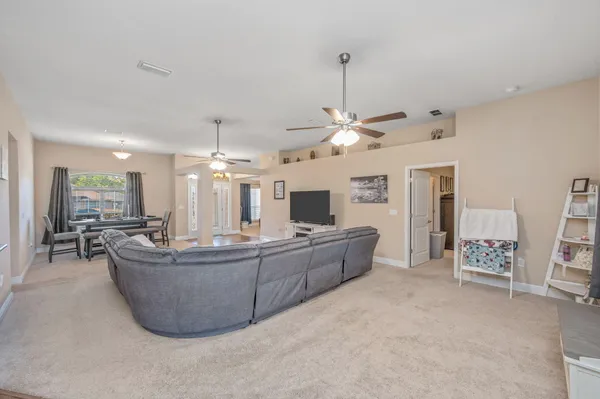 a dining room with furniture and window