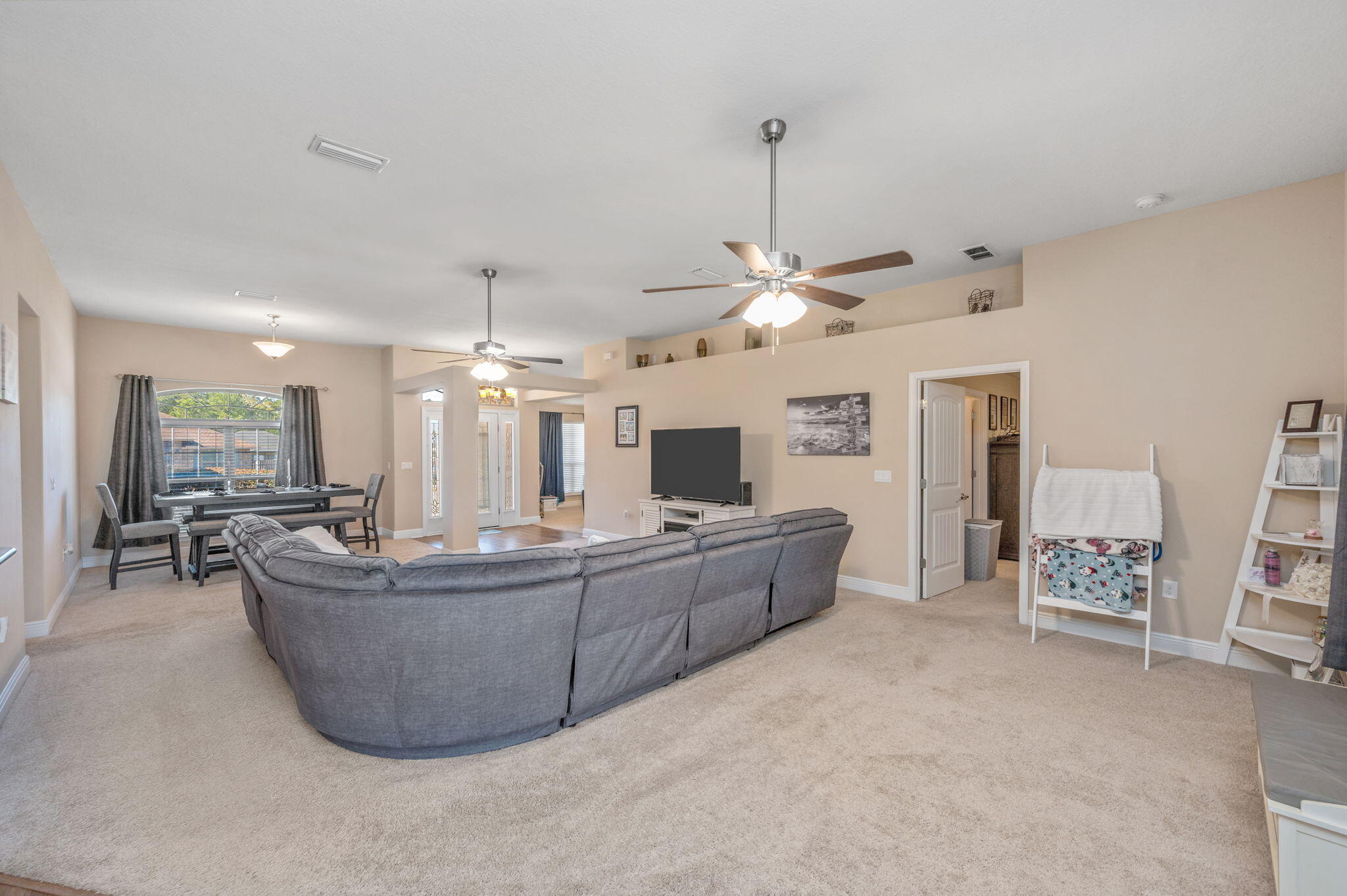 2342 Genevieve Way Crestview, FL 32536 - Photo 7 of 41 a living room with furniture and a flat screen tv